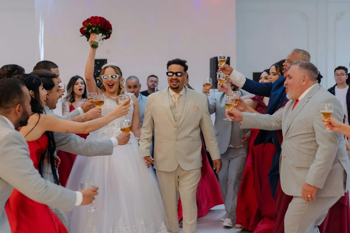 Wedding guests raising a toast to the couple