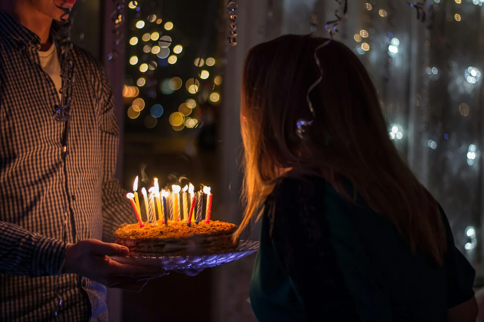 Guests raising glasses during a birthday party toast