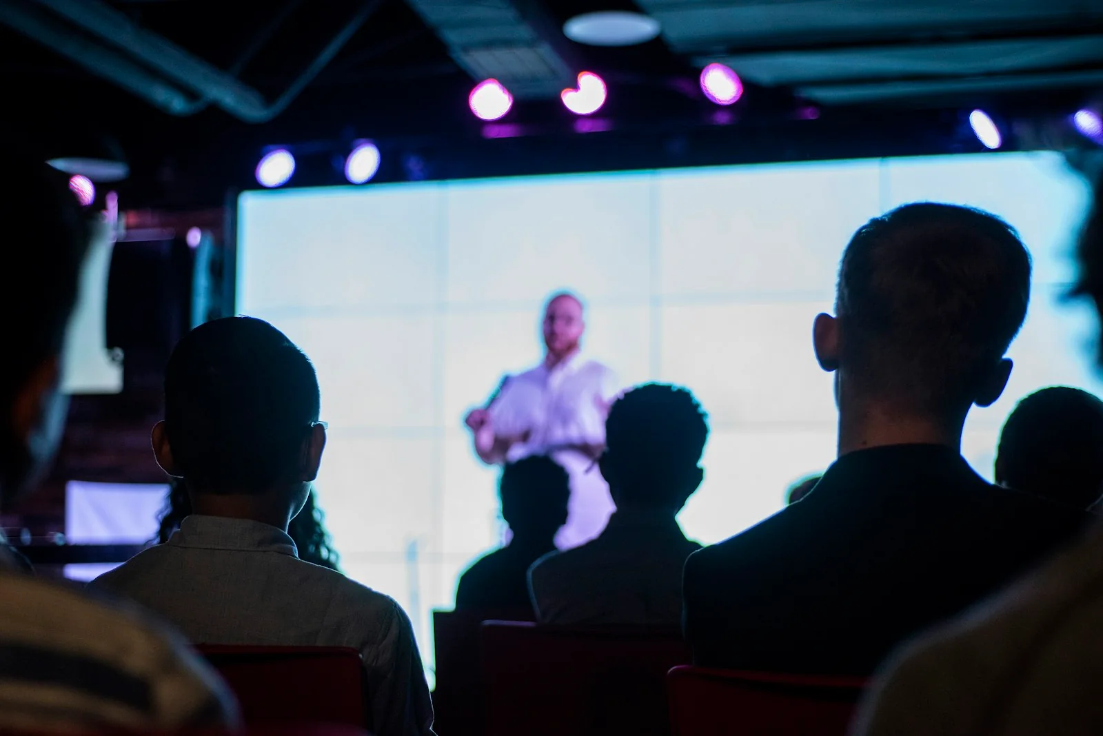 An event attendee recording a moment on their phone