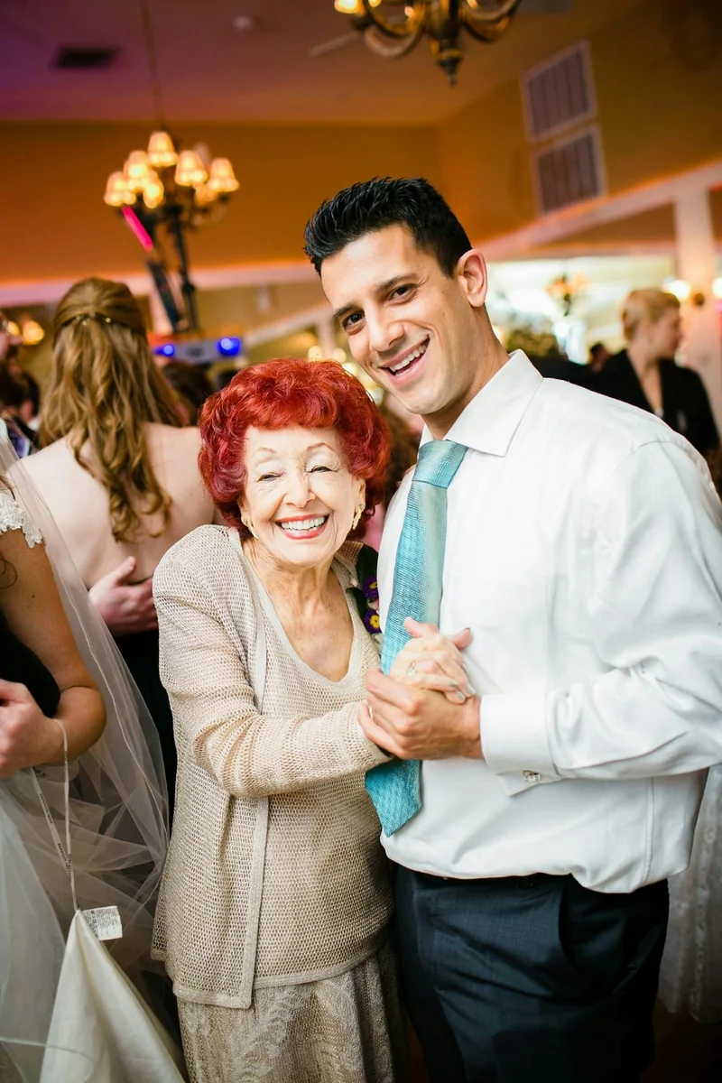 Two generations dancing together at a reception